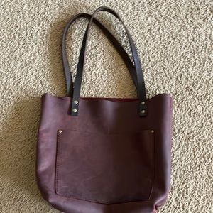 Medium Merlot Portland Leather Goods tote with black handles